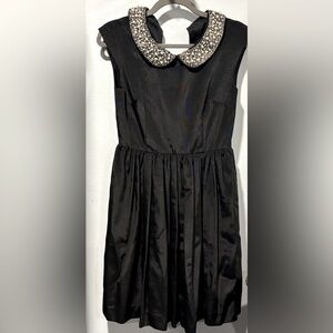 Elegant Black Dress with Embellished Collar